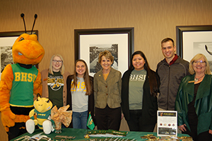 Group of BHSU students, staff, and President Nichols posing with Sting