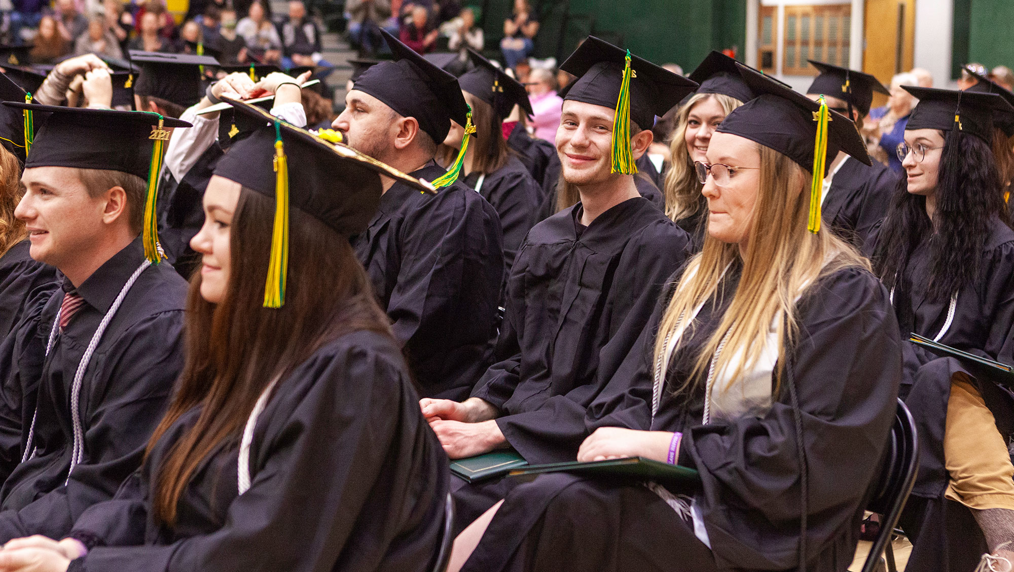 Graduate smiling at BHSU commencement ceremony