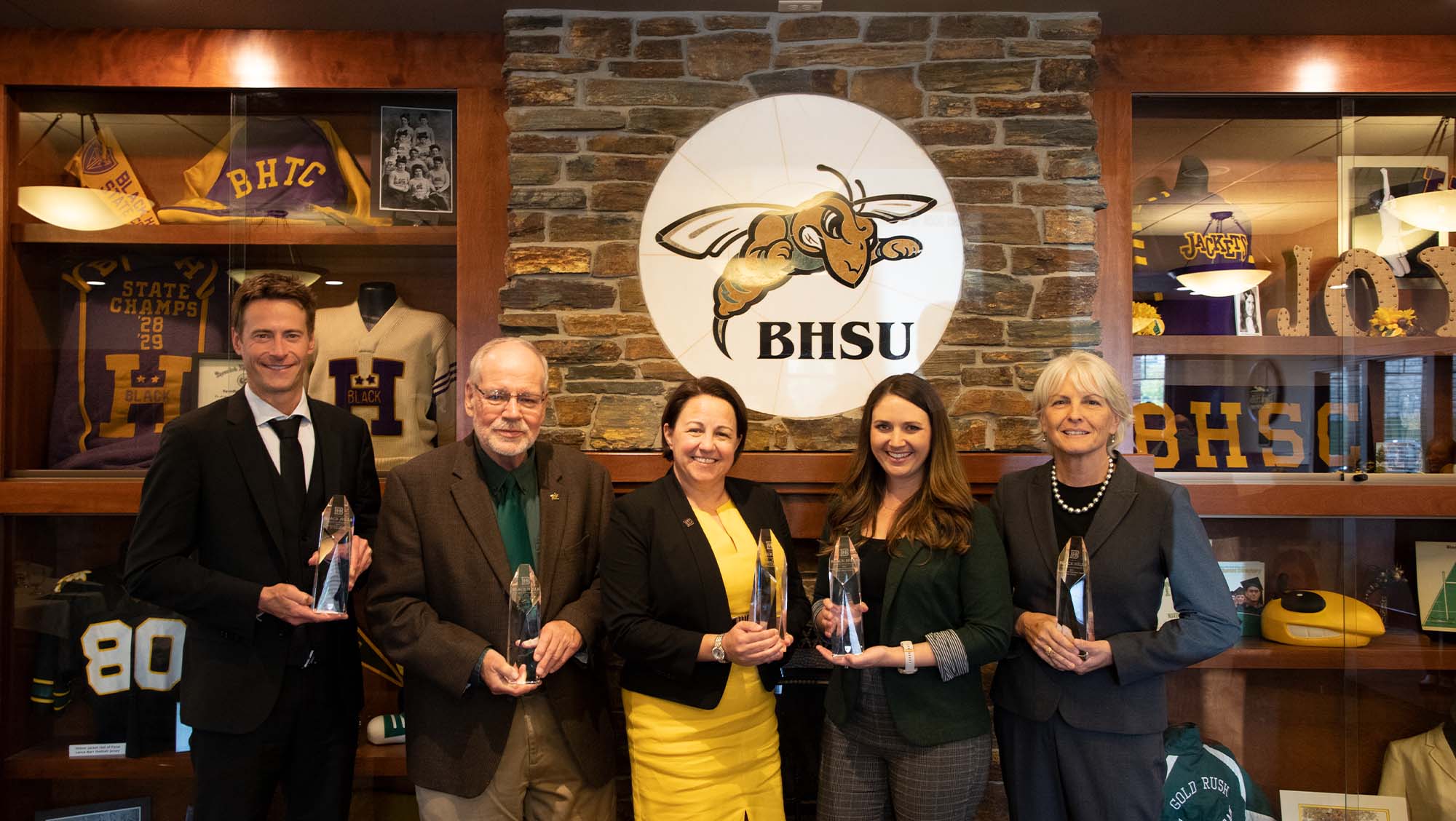 BHSU honors Dr. Nathan Steinle (Far-Left), Dr. David A. Wolff (Left), Col. Stacy L. (Trezona) Goodman, PhD (middle), Ashley (Grable) Hunter (right), Chris Haines (Far right