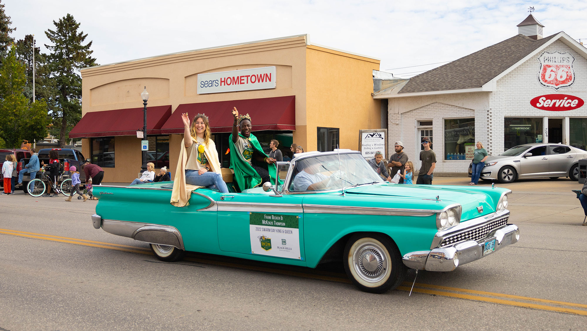  Frank Becker and McKenzie Thompson, the 2022 Swarm Day King and Queen, wave to the audience during the 2022 BHSU Swarm Day Parade