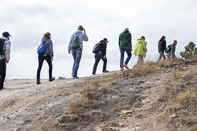 Eight students hike in the Northern Hills.