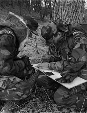 Two cadets training in the field.