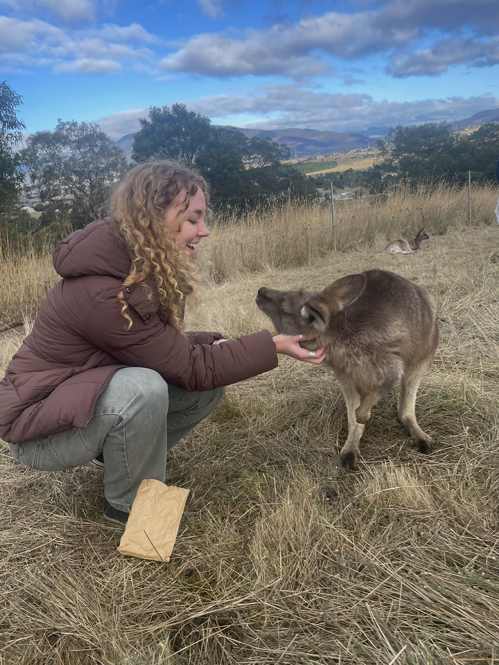 Maggie Peterson pets a kangaroo in Australia.