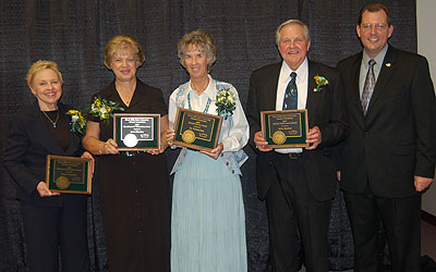 2007 Alumni Award Recipients holding their awards.