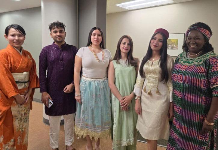 Six international students pose for a photo.