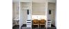 Interior of a Heide Hall room displaying the built-in desk, closets, and sink. 