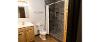 Bathroom of a Yellowjacket Apartment, showing the sink, toilet, and shower.