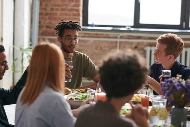 Students sitting at a table and talking