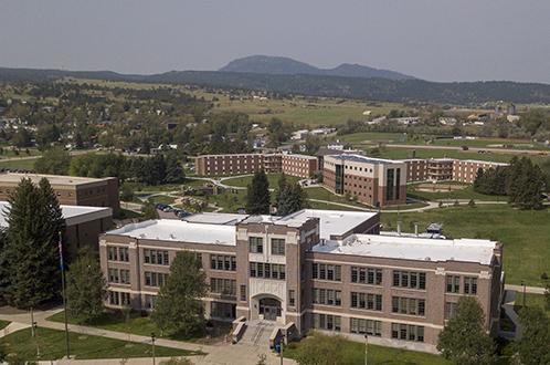Picture of BHSU campus; Woodburn Hall, Meier Hall, and The Peaks Residence Halls