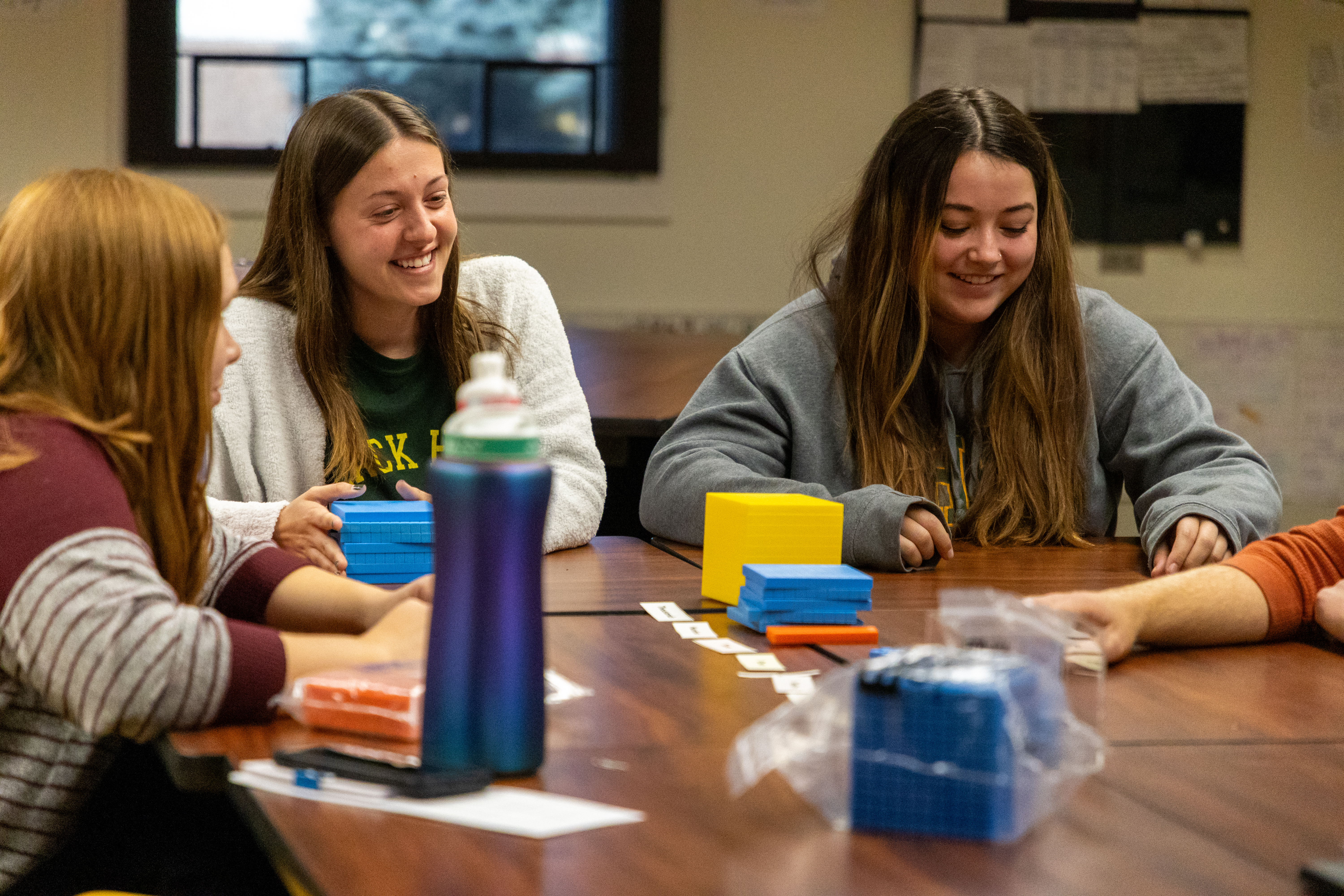 Four math education students work together in class.