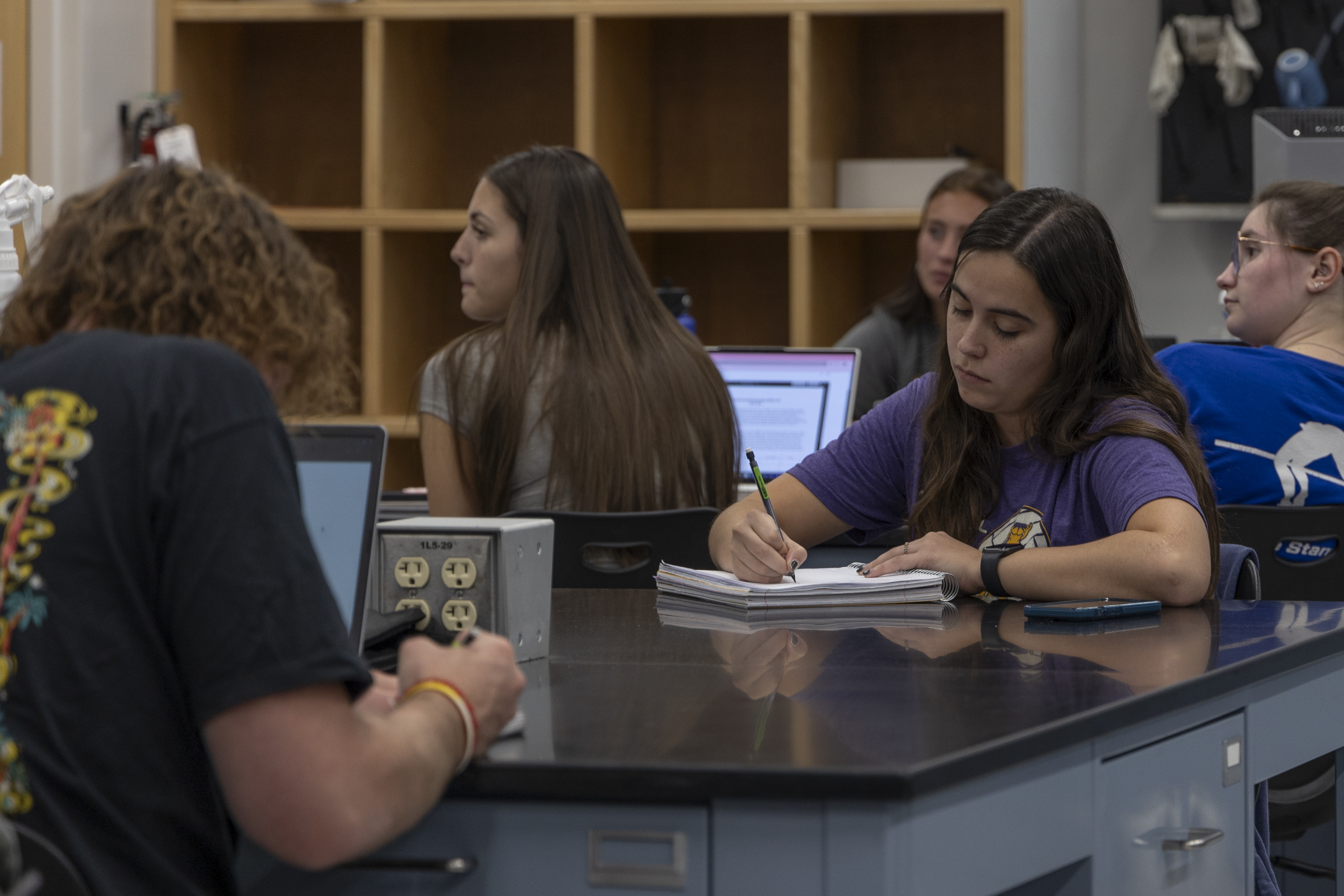 BHSU students sit in a lab and take notes.