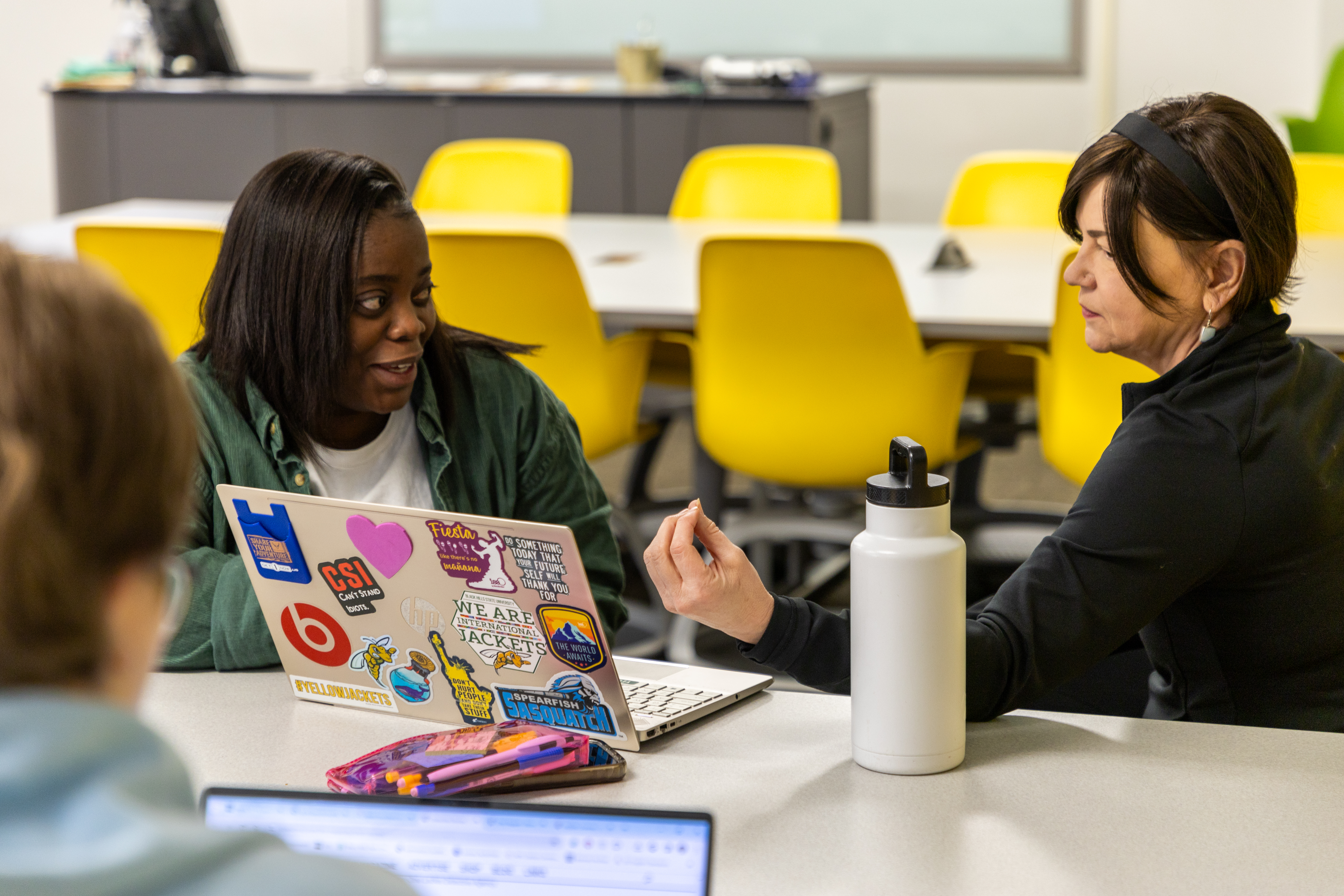 A BHSU education student speaks to a professor.