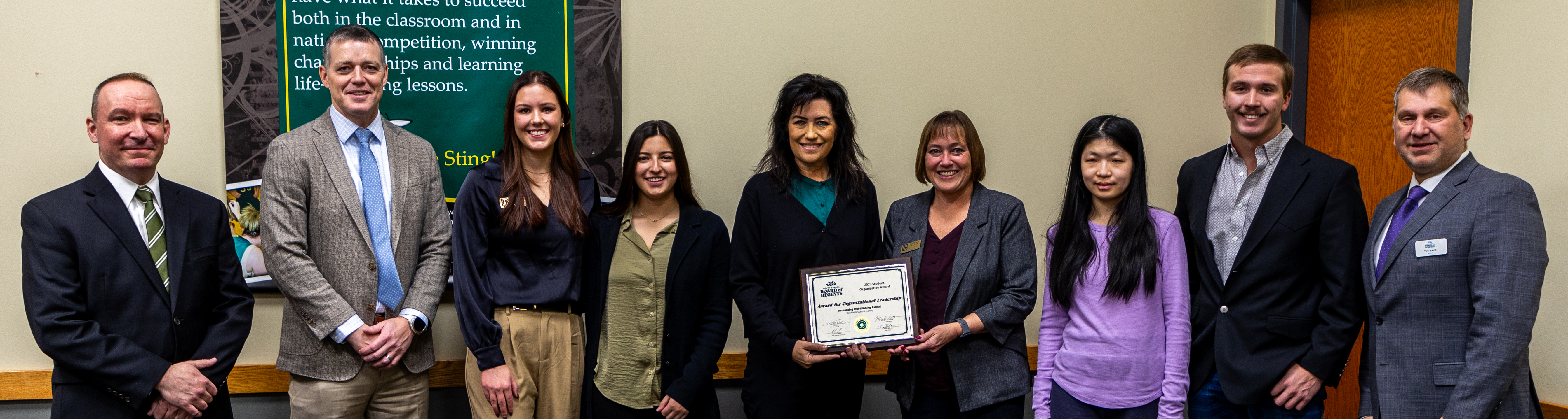 Kicking Assets members pose for a photo with SDBOR members.