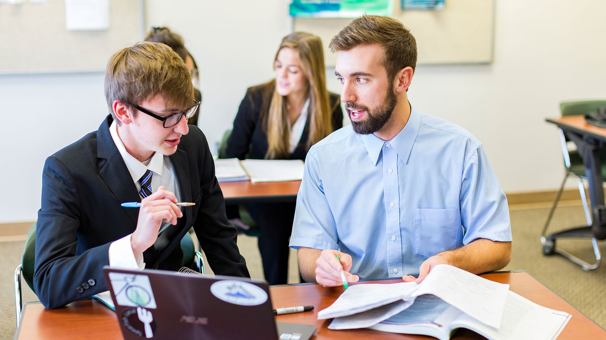 Image of two BHSU students in a business class. 
