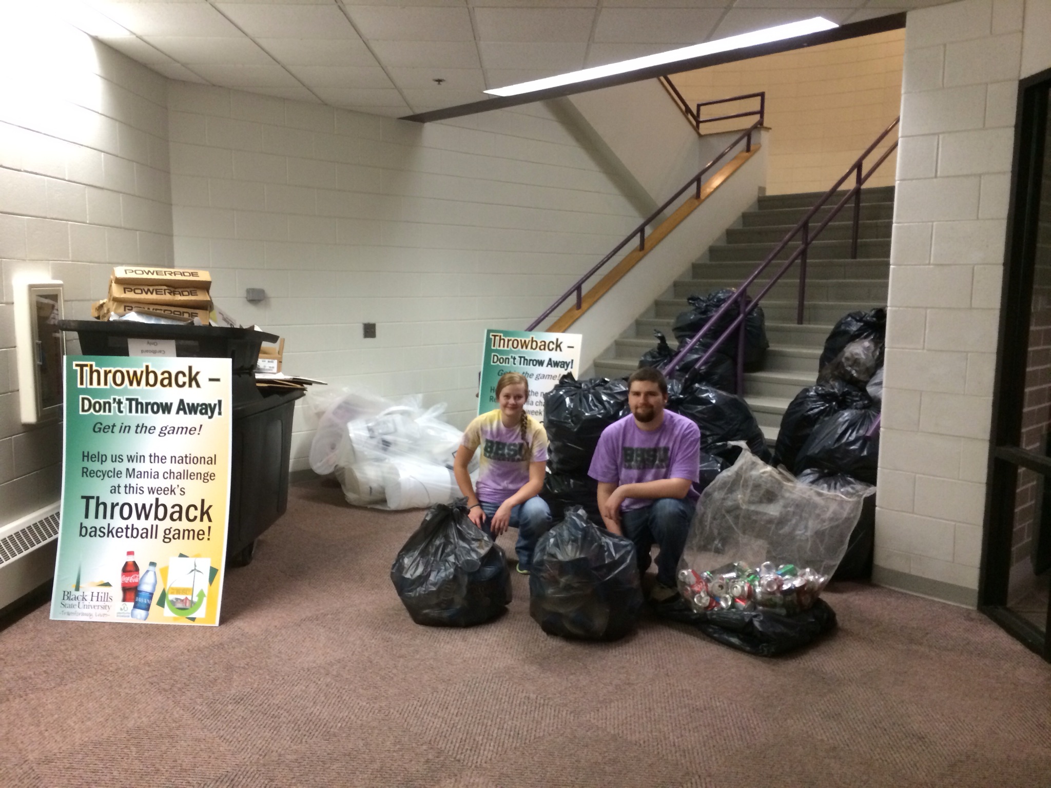 BHSU Students Samantha Starkey (left) and Brady Licht (right) collect recycling.