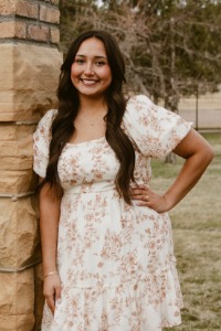 Graduate Alyssa Diaz smiles for the camera