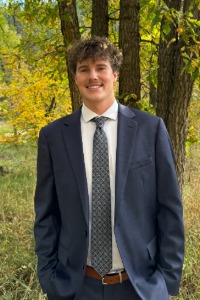 Graduate Owen Growney smiles for the camera